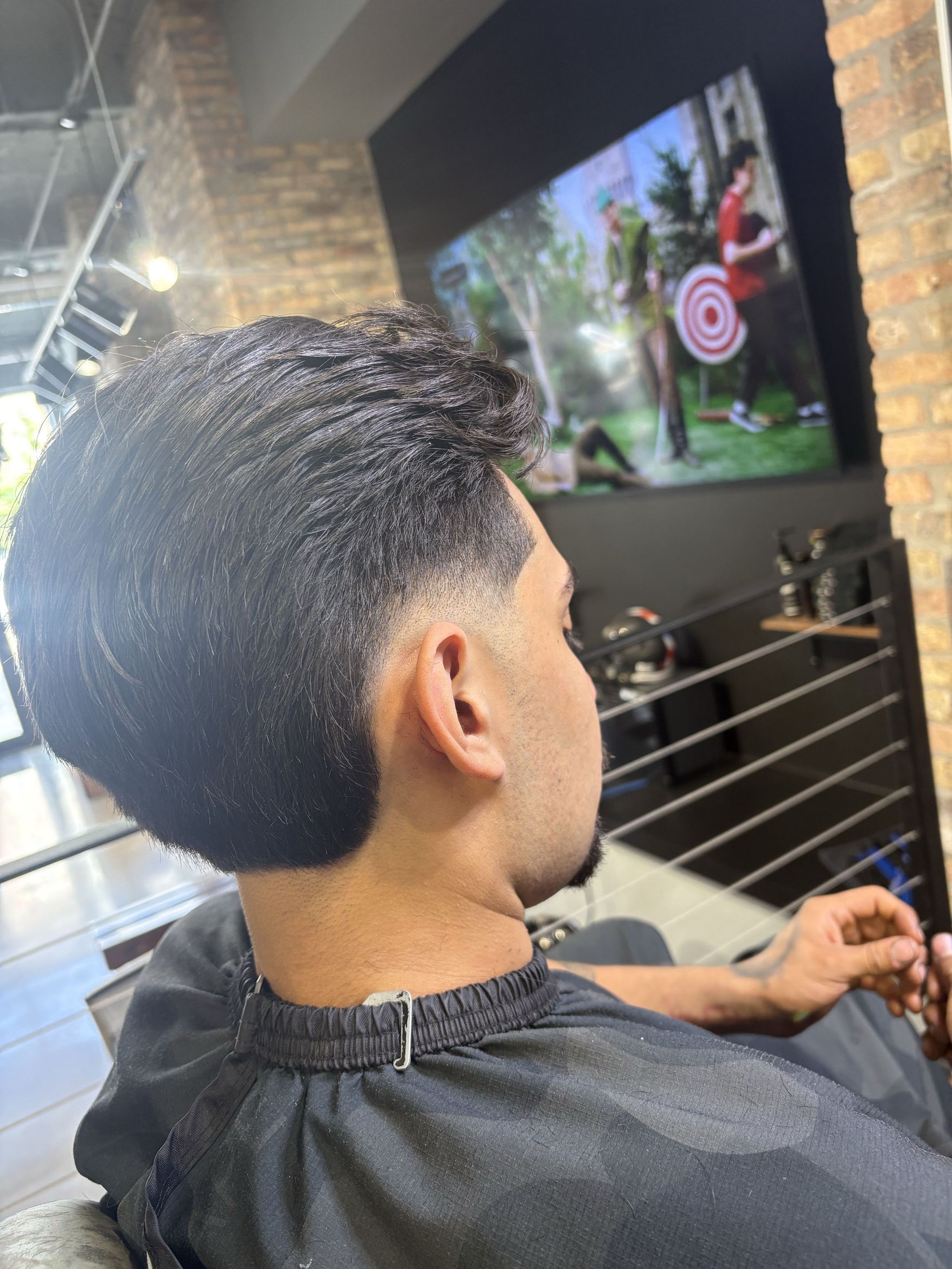 Men's textured top with a low taper fade